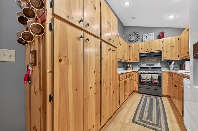 191 Deer Run Rd, Blairsville, GA 30512 - kitchen with stainless steel range with gas cooktop, range hood, lofted ceiling, light wood-type flooring, and light countertops