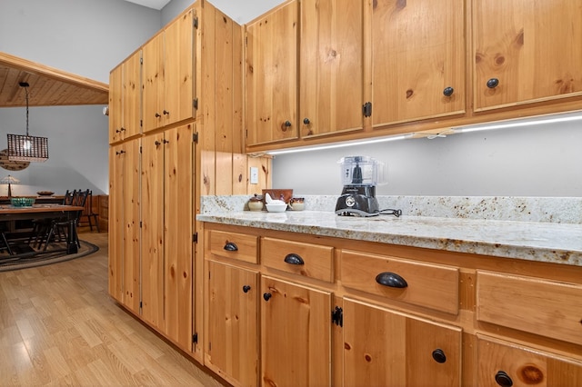 191 Deer Run Rd, Blairsville, GA 30512 - kitchen featuring light wood-style floors, light stone counters, a chandelier, and decorative light fixtures