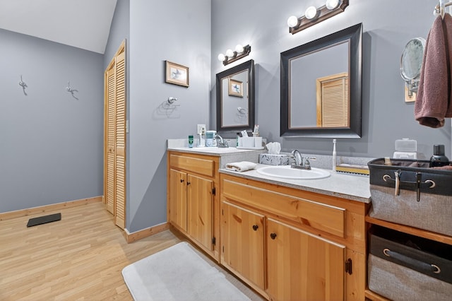191 Deer Run Rd, Blairsville, GA 30512 - bathroom with double vanity, wood finished floors, vaulted ceiling, and a closet