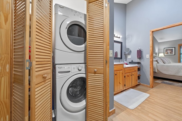 191 Deer Run Rd, Blairsville, GA 30512 - laundry area featuring stacked washer / dryer and light wood-style flooring