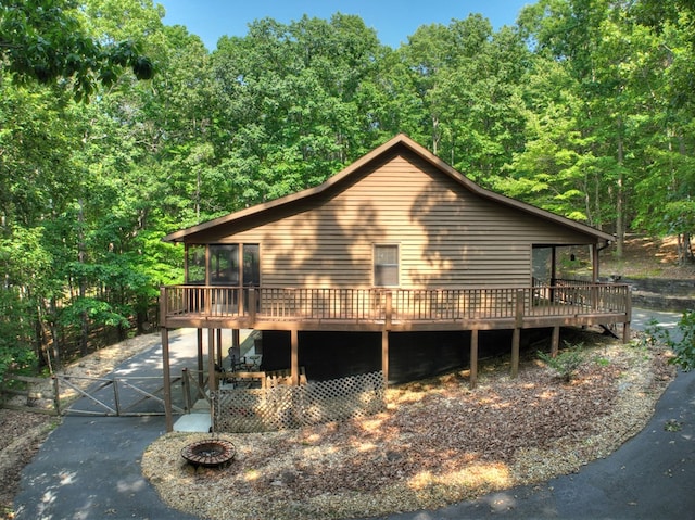 191 Deer Run Rd, Blairsville, GA 30512 - view of property exterior with a wooden deck, a gate, and a view of trees