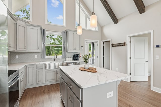 497 S Jakes Landing Way, Ellijay, GA 30540 - kitchen with gray cabinetry, a sink, stainless steel appliances, high vaulted ceiling, and light wood-style flooring