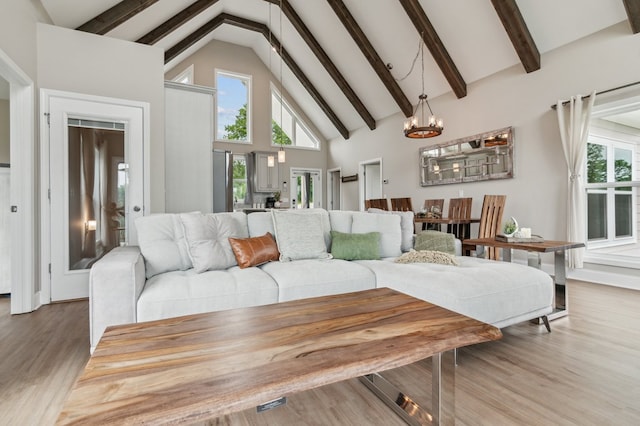 497 S Jakes Landing Way, Ellijay, GA 30540 - living room featuring a chandelier, high vaulted ceiling, wood finished floors, and beam ceiling