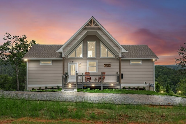 497 S Jakes Landing Way, Ellijay, GA 30540 - back of house at dusk with a wooden deck and roof with shingles