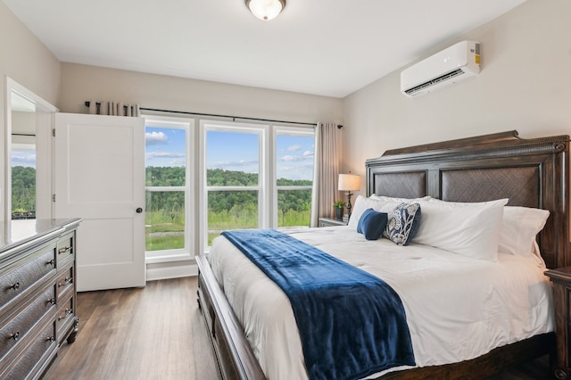 497 S Jakes Landing Way, Ellijay, GA 30540 - bedroom with an AC wall unit and dark wood-type flooring
