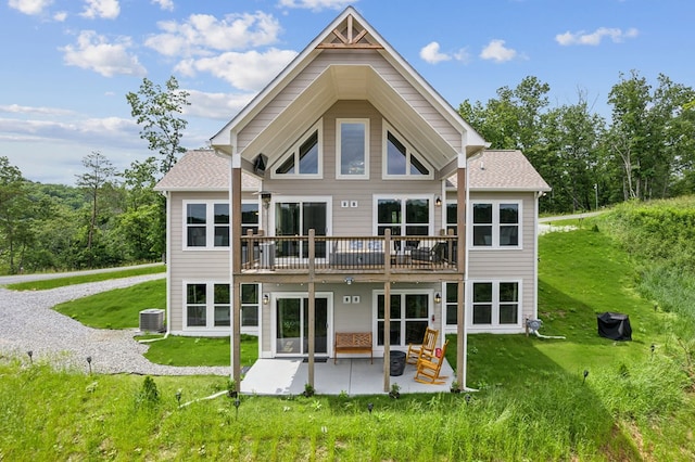 497 S Jakes Landing Way, Ellijay, GA 30540 - back of property featuring cooling unit, a patio, a lawn, and a shingled roof