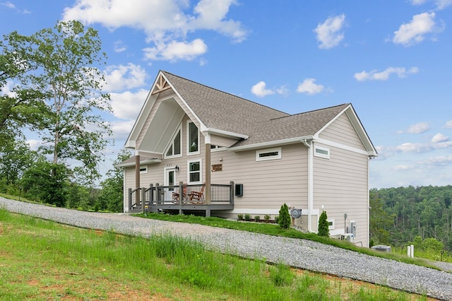 497 S Jakes Landing Way, Ellijay, GA 30540 - back of house featuring a deck, roof with shingles, and gravel driveway