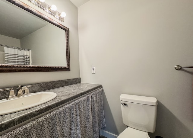 full bathroom with vanity and toilet