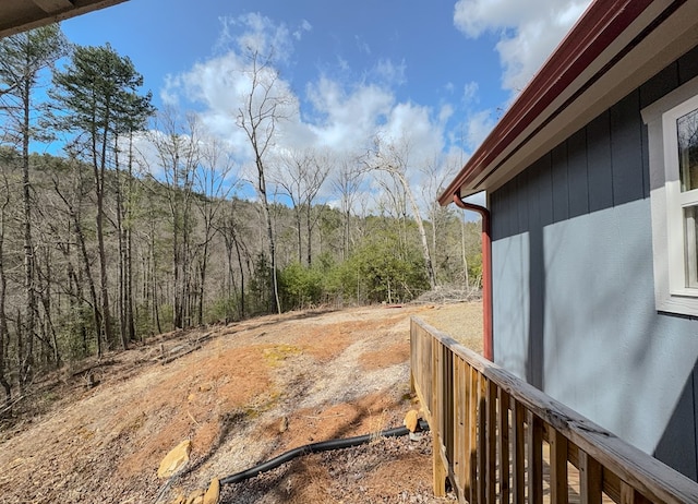 view of yard with a forest view