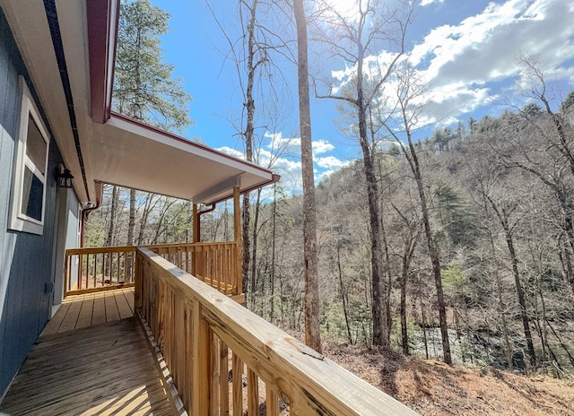 deck featuring a forest view