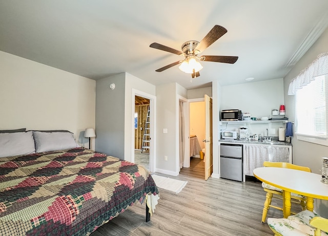 bedroom with baseboards, ceiling fan, a toaster, light wood-style flooring, and fridge