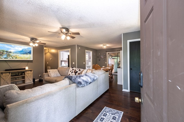 1214 Marrestop Rd, Murphy, NC 28906 - living room with dark wood finished floors, ceiling fan, a textured ceiling, and baseboards