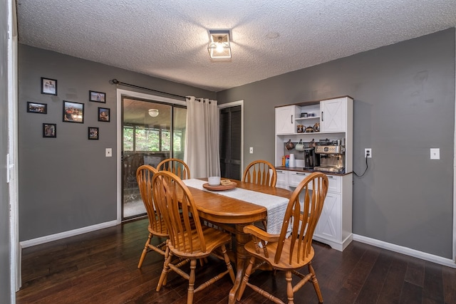 1214 Marrestop Rd, Murphy, NC 28906 - dining room featuring a textured ceiling, dark wood-style flooring, and baseboards