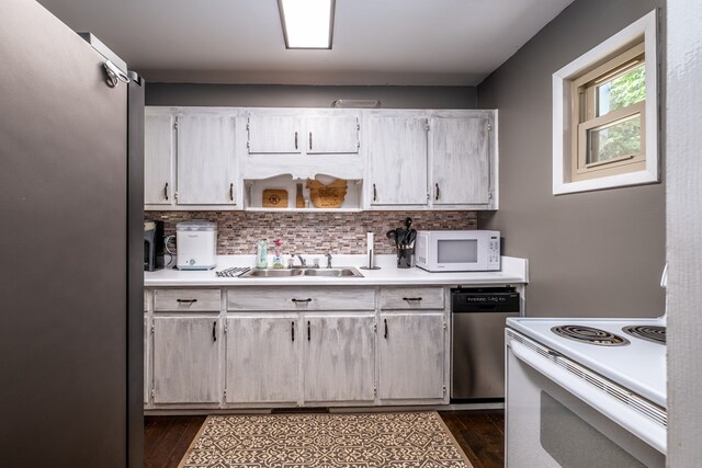 1214 Marrestop Rd, Murphy, NC 28906 - kitchen with appliances with stainless steel finishes, dark wood-style flooring, light countertops, tasteful backsplash, and a sink
