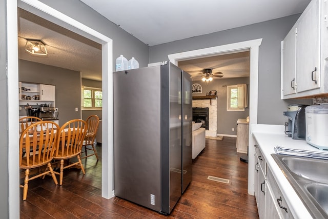 1214 Marrestop Rd, Murphy, NC 28906 - kitchen with freestanding refrigerator, a ceiling fan, a sink, white cabinetry, and dark wood-style flooring