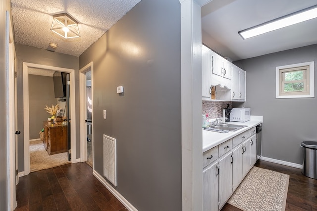 1214 Marrestop Rd, Murphy, NC 28906 - kitchen featuring white microwave, a sink, light countertops, dark wood finished floors, and a textured ceiling