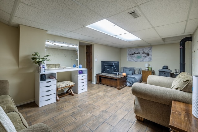 1214 Marrestop Rd, Murphy, NC 28906 - living room featuring a drop ceiling, wood finish floors, and a wood stove