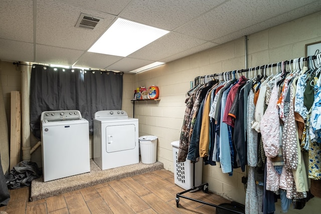 1214 Marrestop Rd, Murphy, NC 28906 - laundry area with washer and dryer, concrete block wall, and wood finished floors