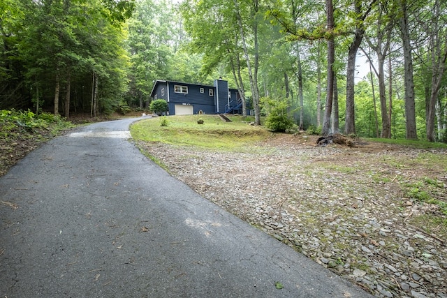 1214 Marrestop Rd, Murphy, NC 28906 - view of front of property with a chimney, asphalt driveway, a view of trees, and a garage
