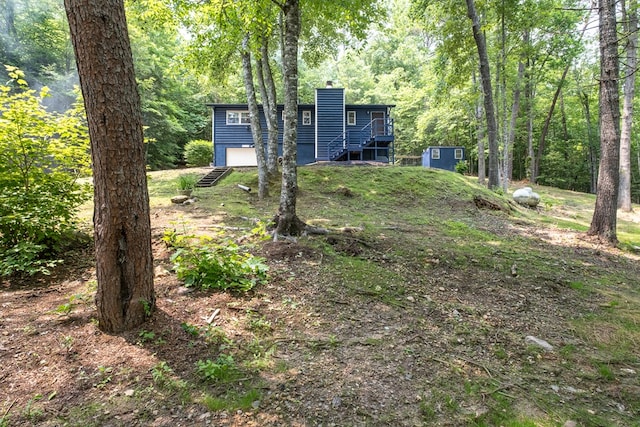 1214 Marrestop Rd, Murphy, NC 28906 - view of yard featuring a garage and a wooded view