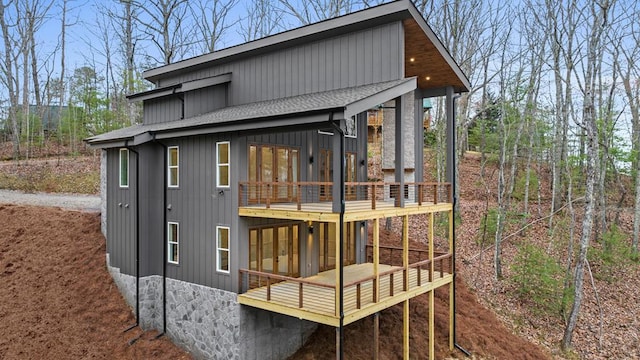 back of house featuring a balcony