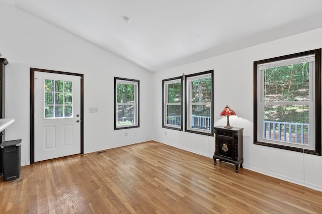 2790 Tamarack Dr, Jasper, GA 30143 - unfurnished living room with lofted ceiling and light wood-style flooring