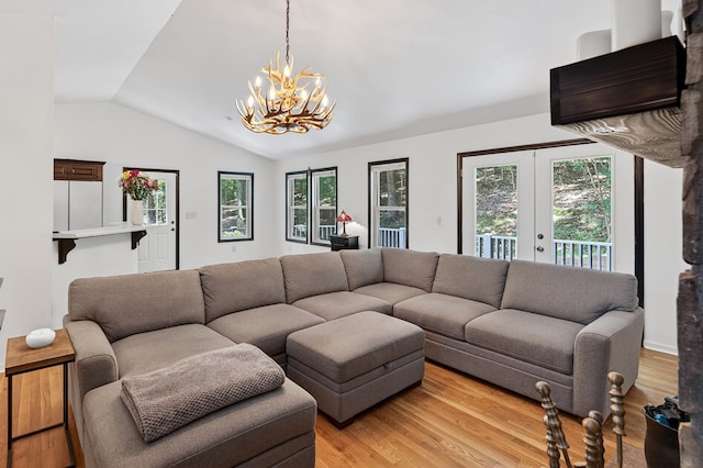 2790 Tamarack Dr, Jasper, GA 30143 - living area with vaulted ceiling, a chandelier, and light wood finished floors