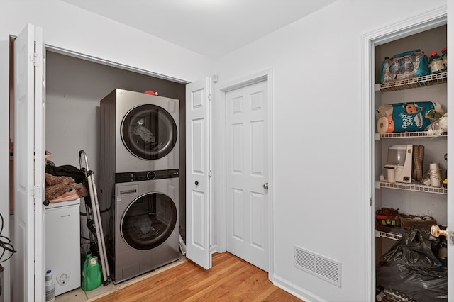 2790 Tamarack Dr, Jasper, GA 30143 - washroom featuring stacked washer and clothes dryer and light wood-style flooring