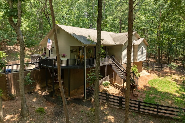 2790 Tamarack Dr, Jasper, GA 30143 - back of house with a shingled roof, a deck, a fenced backyard, stairs, and a view of trees