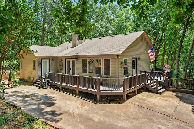 2790 Tamarack Dr, Jasper, GA 30143 - rear view of property featuring a chimney, a deck, roof with shingles, and a patio