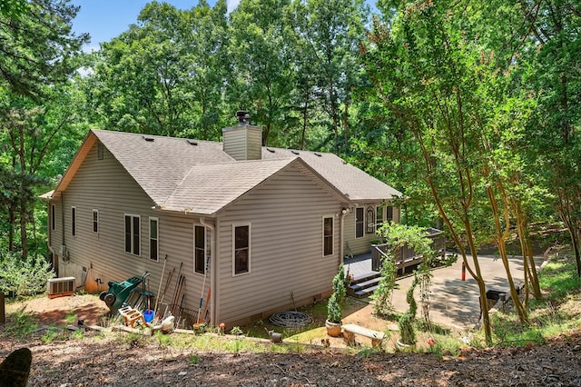 2790 Tamarack Dr, Jasper, GA 30143 - back of property featuring a deck, roof with shingles, a chimney, and a patio