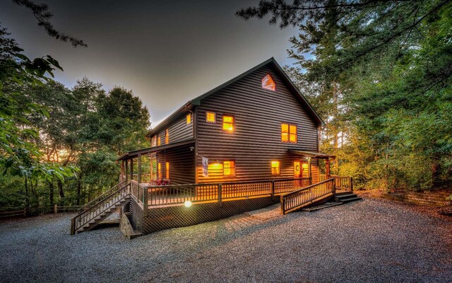 rear view of house featuring a patio and a sunroom