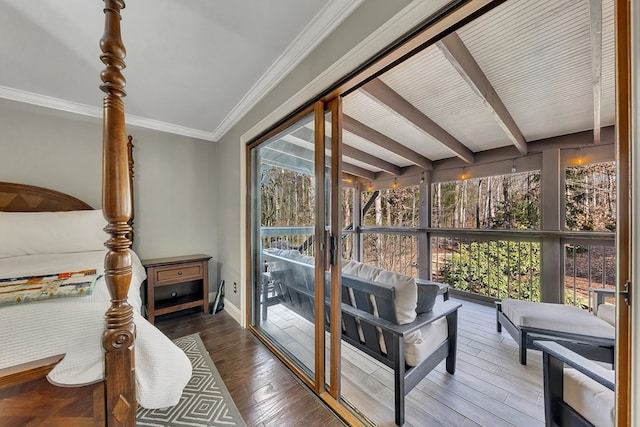 sunroom featuring beam ceiling