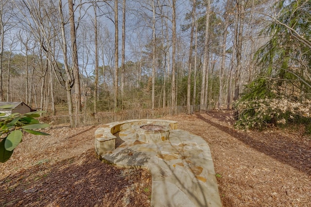 view of yard with a fire pit