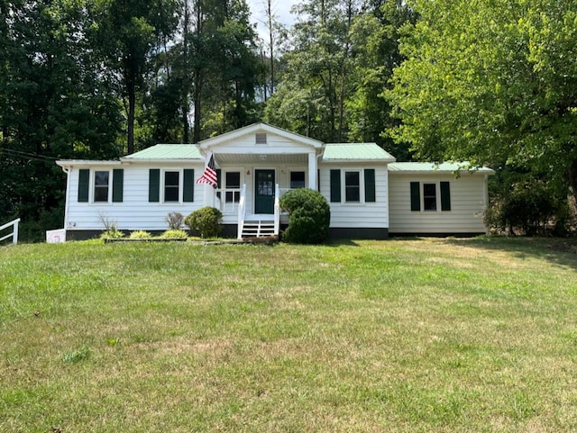 view of front of home with a front yard and covered porch