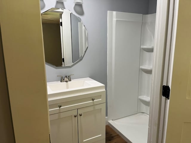 bathroom with vanity and hardwood / wood-style floors