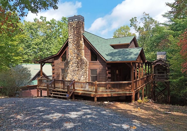 back of property with a wooden deck