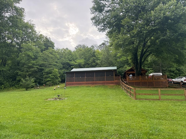 100 Bryant Farm Rd, Murphy, NC 28906 - view of green lawn featuring a sunroom, a wooden deck, and a forest view