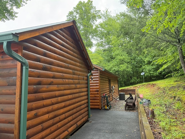 100 Bryant Farm Rd, Murphy, NC 28906 - view of side of property with log veneer siding and a patio area