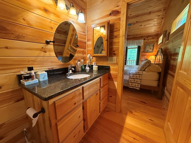 100 Bryant Farm Rd, Murphy, NC 28906 - bathroom featuring wooden walls, vanity, and wood finished floors