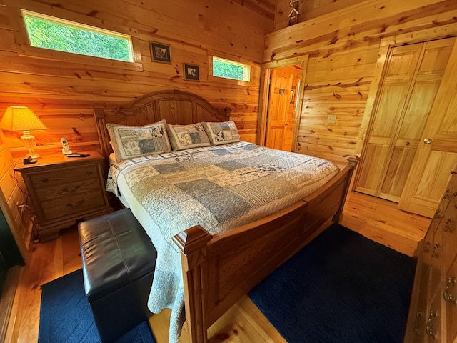 100 Bryant Farm Rd, Murphy, NC 28906 - bedroom featuring wood walls and light wood-style floors