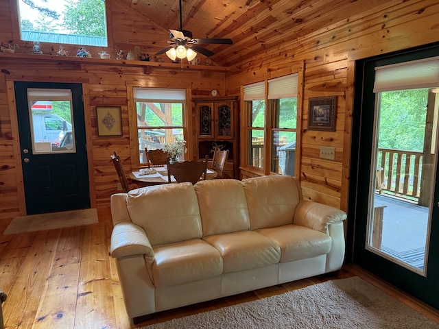 100 Bryant Farm Rd, Murphy, NC 28906 - living room with vaulted ceiling, wooden walls, wood-type flooring, plenty of natural light, and a ceiling fan