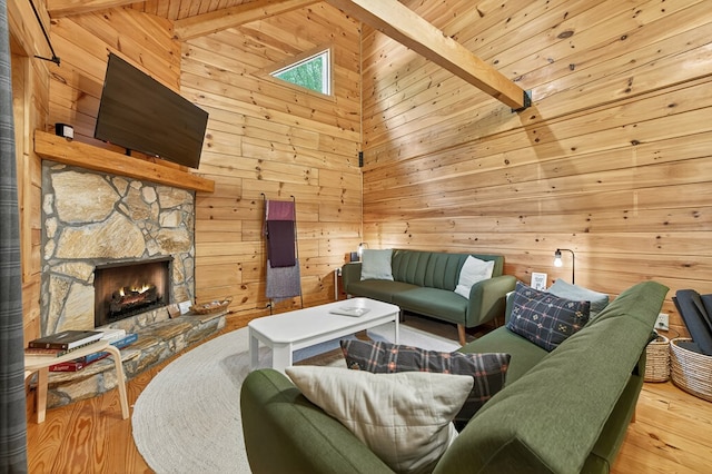 305 Kimbolton Dr, Morganton, GA 30560 - living room featuring wood walls, beam ceiling, wood finished floors, high vaulted ceiling, and a fireplace