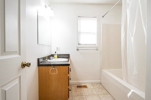 bathroom with vanity, tile patterned floors, and shower / bath combo