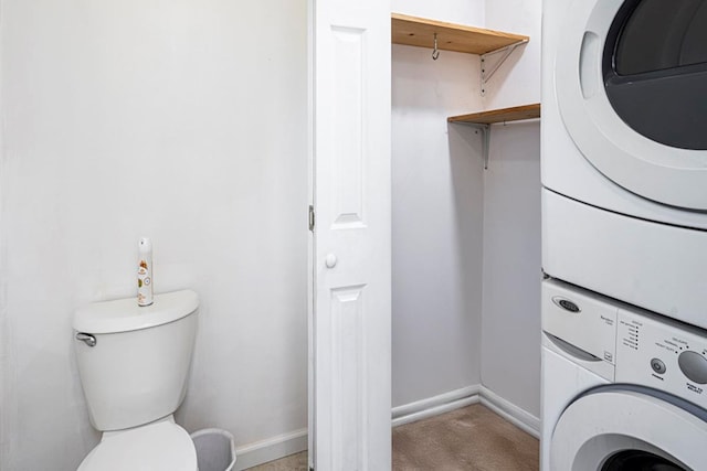 laundry area with stacked washing maching and dryer