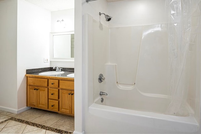 bathroom featuring tile patterned floors, a textured ceiling, shower / bath combo with shower curtain, and vanity