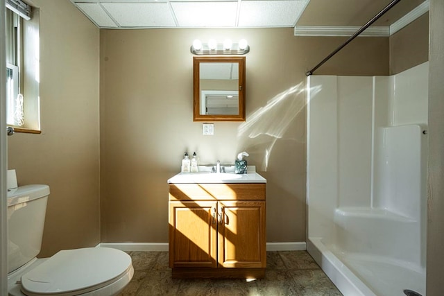 bathroom with walk in shower, vanity, and toilet