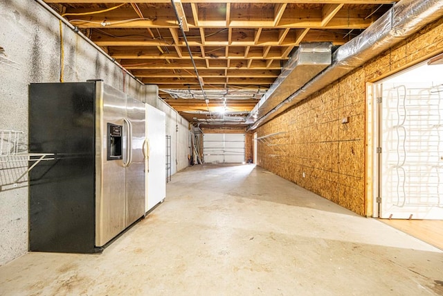 garage with stainless steel fridge with ice dispenser