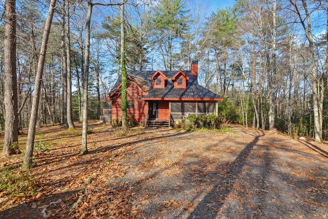 view of front of property featuring a sunroom