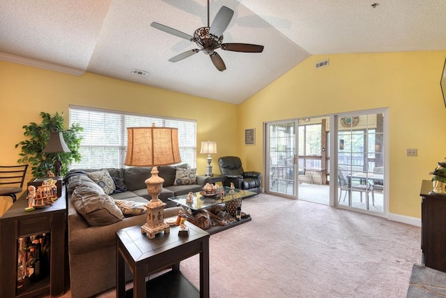 living room featuring a textured ceiling, vaulted ceiling, ceiling fan, and light colored carpet